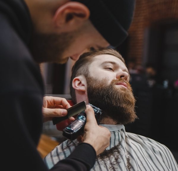 Barber cuts beard to a brutal guy